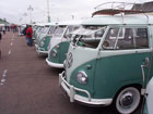 Long row of white over green vans