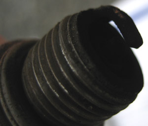 Spark plug covered in soot